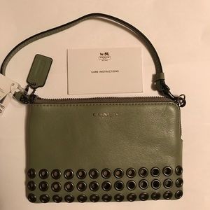 Coach olive grey grommet wristlet